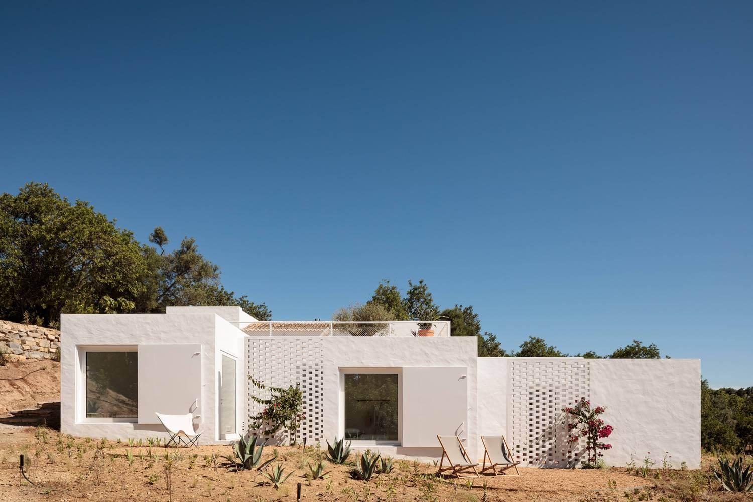 Whitewashed home under clear blue sky